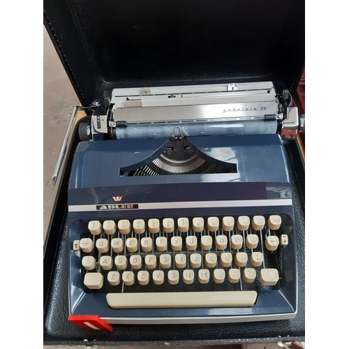 234 - A vintage black cased Adler Gabriele 35 typewriter