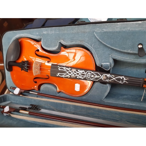 238 - An ornate full size violin with big cat scroll, mother of pearl inlaid fingerboard and back in brown... 