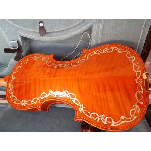 238 - An ornate full size violin with big cat scroll, mother of pearl inlaid fingerboard and back in brown... 