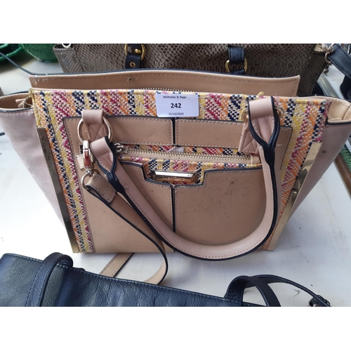 242 - A four ladies handbags to include two River Island, Michael Kors and a Taurus