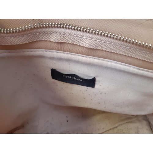 242 - A four ladies handbags to include two River Island, Michael Kors and a Taurus