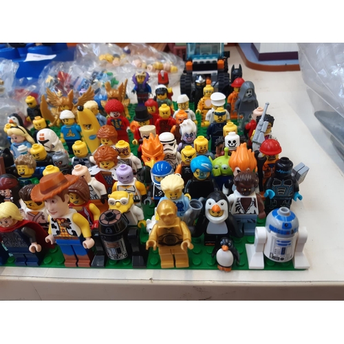 258 - An extensive collection of Lego (mostly figurines) to include R2D2, Woody, Batman, The Joker, Jack S... 