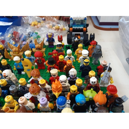 258 - An extensive collection of Lego (mostly figurines) to include R2D2, Woody, Batman, The Joker, Jack S... 