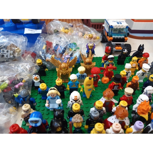 258 - An extensive collection of Lego (mostly figurines) to include R2D2, Woody, Batman, The Joker, Jack S... 