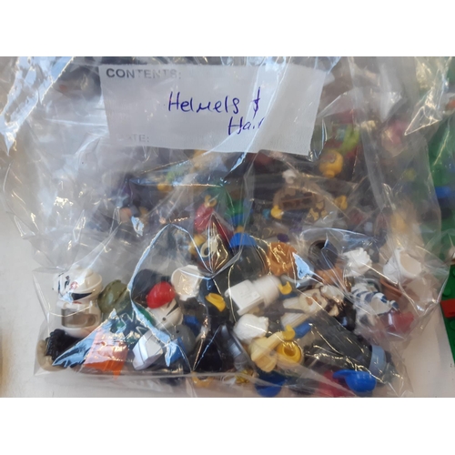 258 - An extensive collection of Lego (mostly figurines) to include R2D2, Woody, Batman, The Joker, Jack S... 