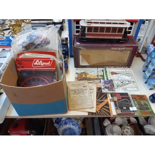 262 - A collection of railway memorabilia to include LMS locomotive book, British bus fleets book, magazin... 