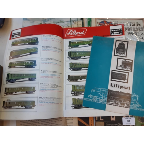 262 - A collection of railway memorabilia to include LMS locomotive book, British bus fleets book, magazin... 