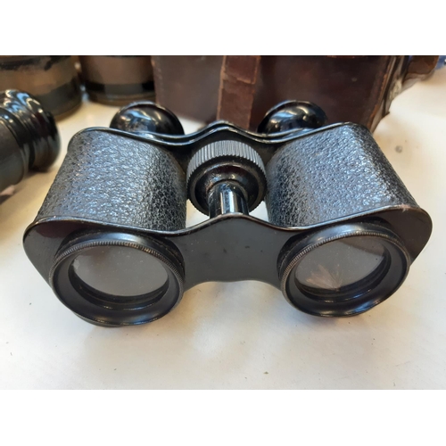 264 - Three vintage binoculars to include jumelle marine and two others