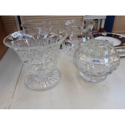 271 - A collection of glassware to include a tri footed cut glass fruit bowl, cut crystal water jug, etc.