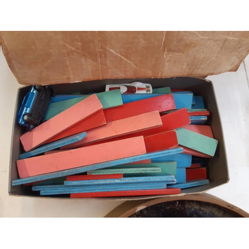 272 - A box containing a collection of vintage wooden building blocks