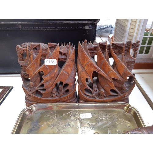 275 - A collection of oriental ornaments to include a pair of carved teak wood book ends with nautical sce... 