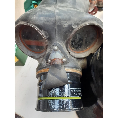 280 - Two items to include a WWII home office gas mask and a WWII Brodie Helmet