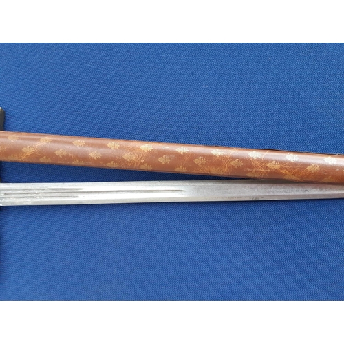 338A - A decorative Sword in brown leather scabbard