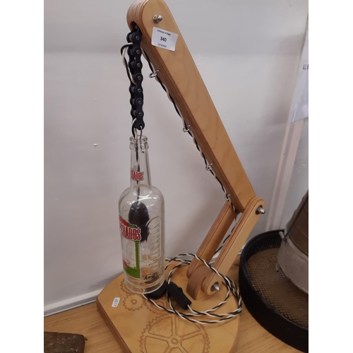 340 - A rustic scratch built table lamp with Desperados bottle shade