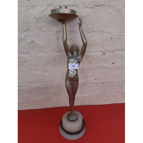 348 - An Art Deco style bronze effect nude lady table lamp on white onyx base - measuring approx. 50cm hig... 