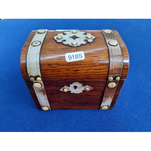 350 - A 19th century French oak tea caddy in the form of a treasure chest with ivory button decoration