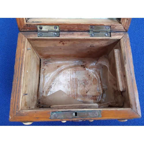 350 - A 19th century French oak tea caddy in the form of a treasure chest with ivory button decoration