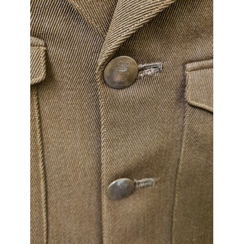 335B - A Rogers & Co. Ltd military dress jacket with brass buttons and blue and red striped trousers