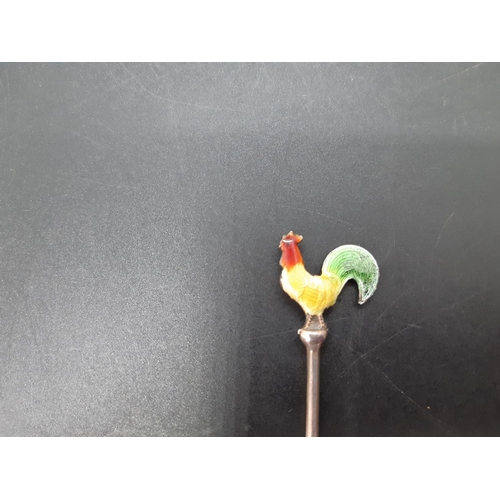 15 - A set of six sterling silver cocktail sticks with enamel cockerel finial top