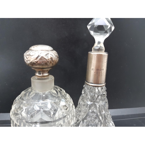 30 - Eight items to include a cut glass perfume bottle with hallmarked Birmingham silver top, a cut glass... 