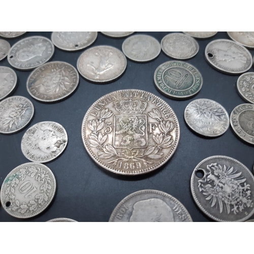 36 - A collection of pre 1920 presumed silver world coins to include 1869 Leopold II Belgian 5 franc coin... 