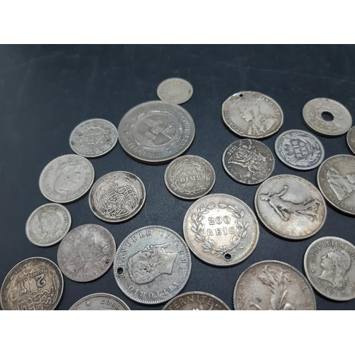 36 - A collection of pre 1920 presumed silver world coins to include 1869 Leopold II Belgian 5 franc coin... 