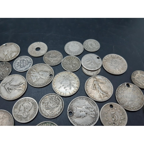 36 - A collection of pre 1920 presumed silver world coins to include 1869 Leopold II Belgian 5 franc coin... 