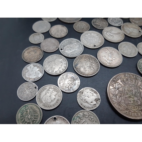 36 - A collection of pre 1920 presumed silver world coins to include 1869 Leopold II Belgian 5 franc coin... 