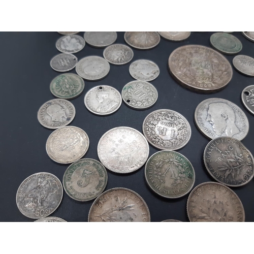 36 - A collection of pre 1920 presumed silver world coins to include 1869 Leopold II Belgian 5 franc coin... 