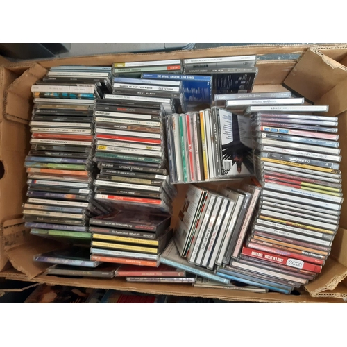 363 - Four boxes containing various CDs and a Laurel & Hardy complete collection DVD box set