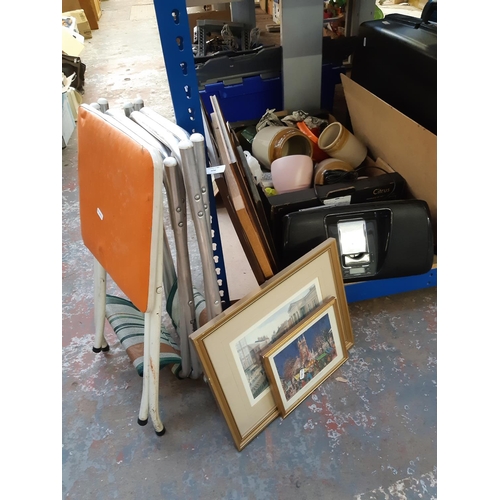 406 - A box containing mixed items to include framed prints, folding camping chairs, china etc.