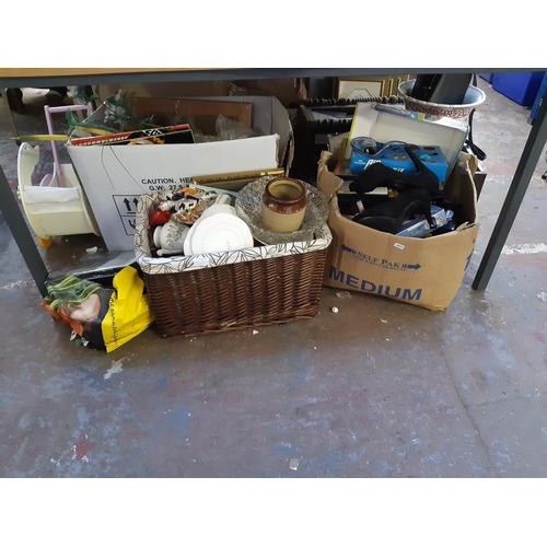 407 - Two boxes and a bag containing mixed items to include ceramics, glassware, DVDs, wooden child's swan... 