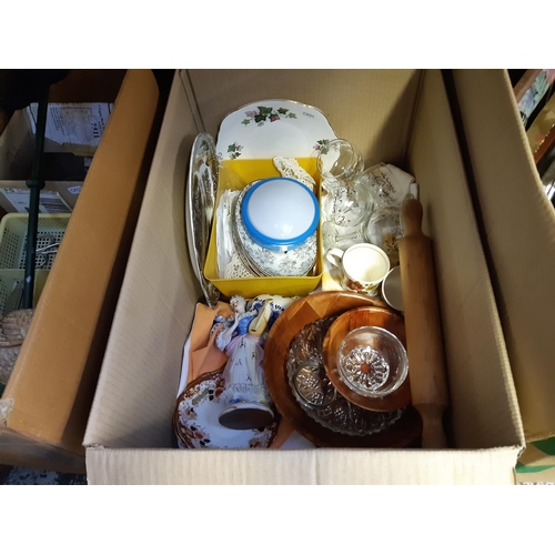 410 - Three boxes containing mixed items to include cast iron mallard duck door stop, cutlery, glassware, ... 