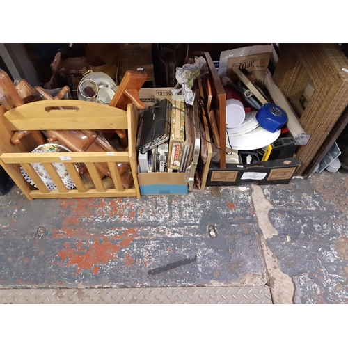 413 - Three boxes containing mixed items to include ceramics, embossed brass magazine rack, brown leather ... 