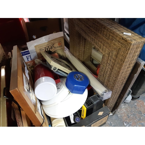 413 - Three boxes containing mixed items to include ceramics, embossed brass magazine rack, brown leather ... 