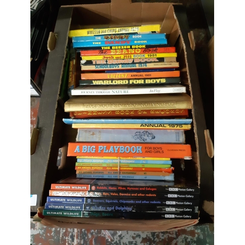 425 - A box containing a quantity of vintage children's books and annuals to include 1978 Whizzer and Chip... 