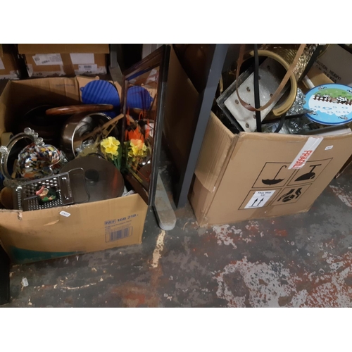 426 - Five boxes containing mixed items to include mottled glass handled basket, embossed brass magazine r... 