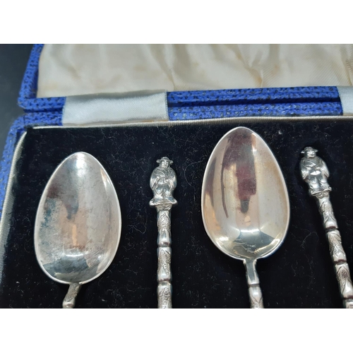 6 - A cased set of six hallmarked oriental 900 grade silver tea spoons with Chinese elder figural top an... 