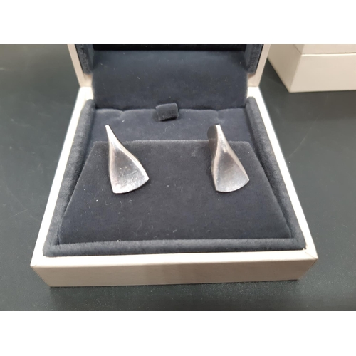 66 - Three boxed Georg Jensen 925 silver items to include necklace with pendant and two pairs of earrings... 