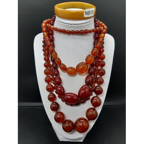 68 - Three vintage worked amber necklaces to include one cherry amber necklace with 9ct gold clasp and a ... 