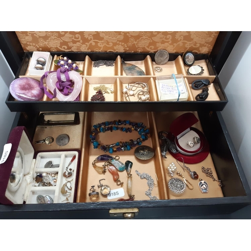 72a - A black jewellery box containing a collection of vintage costume jewellery to include Whitby jet sty... 