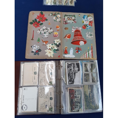 80 - A folder containing various antique and vintage postcards together with a mid 20th century scrap alb... 