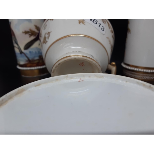 117 - Four items to include a Victorian cabinet cup and saucer with hand painted floral design with gold r... 