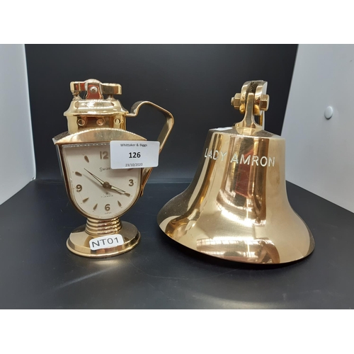 126 - Two pieces of brassware to include a vintage Swiza 7 jewels table lighter mantle clock (see conditio... 