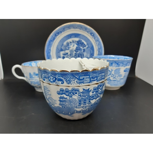 127 - Four pieces of antique blue and white china to include a Royal Worcester tea cup with oriental pagod... 