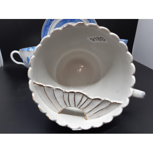 127 - Four pieces of antique blue and white china to include a Royal Worcester tea cup with oriental pagod... 