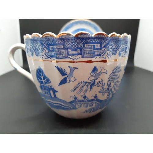 127 - Four pieces of antique blue and white china to include a Royal Worcester tea cup with oriental pagod... 