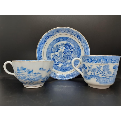 127 - Four pieces of antique blue and white china to include a Royal Worcester tea cup with oriental pagod... 