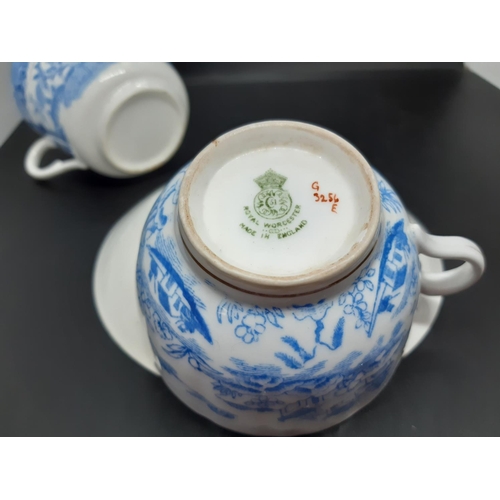 127 - Four pieces of antique blue and white china to include a Royal Worcester tea cup with oriental pagod... 