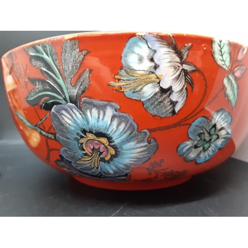 128 - Three pieces of Clarice Cliff pottery to include a red floral patterned bowl measuring approx. 19.5c... 